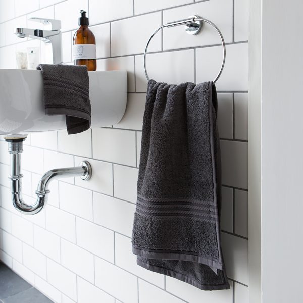 large bath towels grey hand towels face cloths bathroom sink white subway tiles