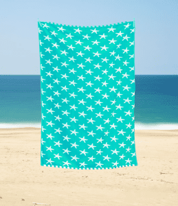 large beach towel luxury soft feel with star fish ocean pattern on a blue teal background with white reverse