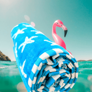 beach towel blue with starfish patern and a flamingo