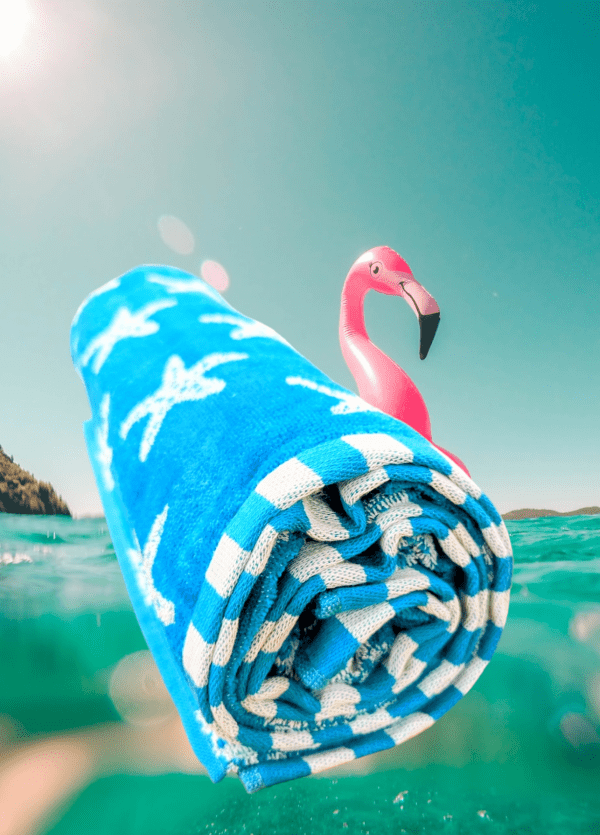 beach towel blue with starfish patern and a flamingo