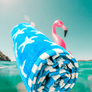 beach towel blue with starfish patern and a flamingo