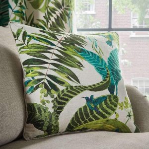 tropical leaf cushion cover with hummingbrid and palm leaf pattern green print on a natural colour background