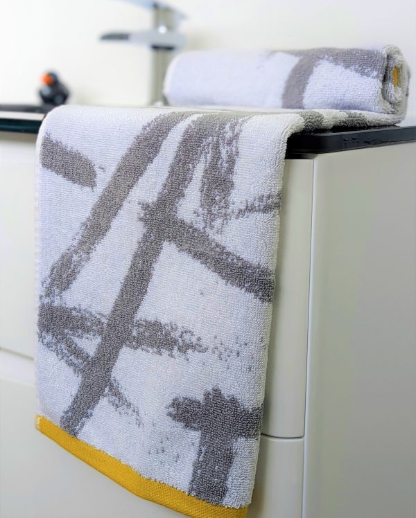 Abstract pattern towels. brush stroke grey yellow cotton hand towel