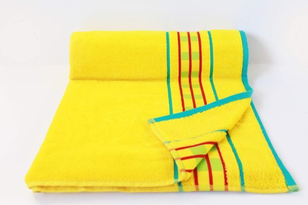 arabella yellow luxury beach towel rolled