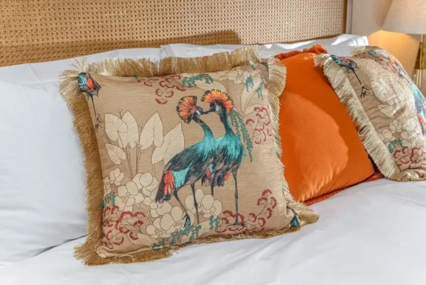 dunelm mariba gold cushion on a bed